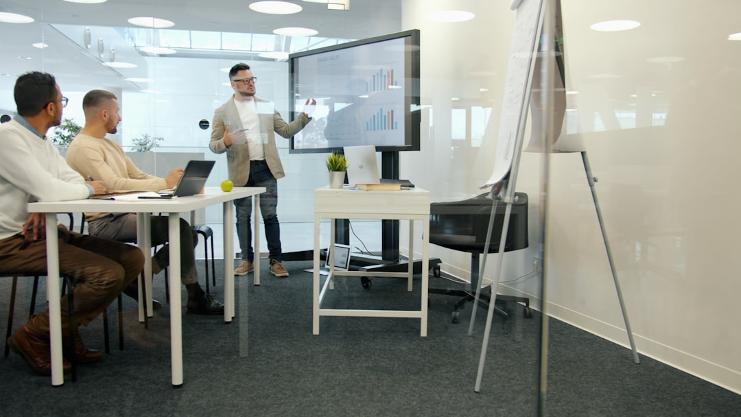 Colleagues gathered around a table during a client briefing